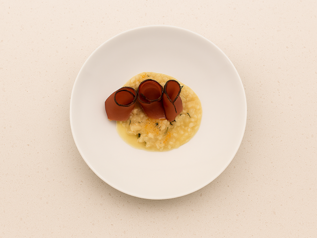 Risotto con mele, speck e Schüttelbrot dell’Alto Adige